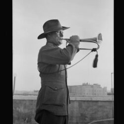 Lord Kitchner's bugler in 1915, Pvt Frank Inman of Australian Imperial Forces. Mr. Inman trumpeting at Anzac Day services on 25 April 1940. From the Matson Collection.